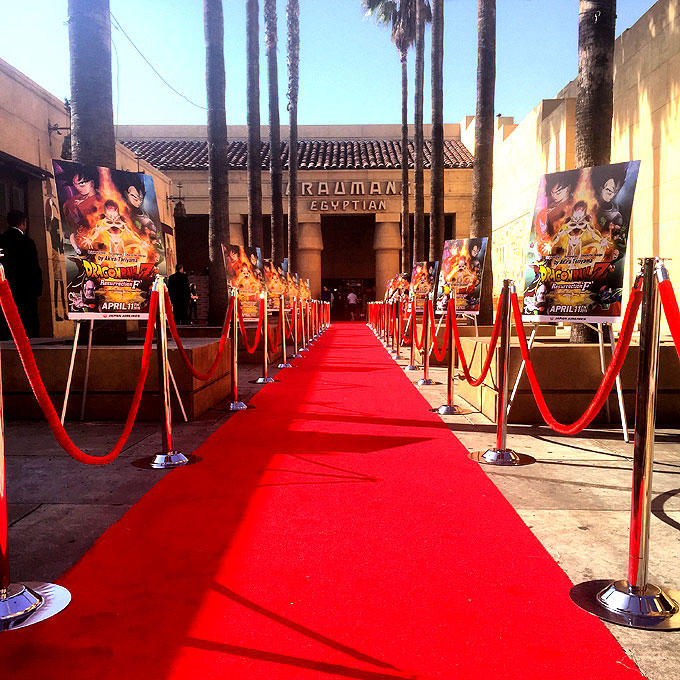 Red carpet, red rope, stanchions and movie posters for Hollywood movie premiere