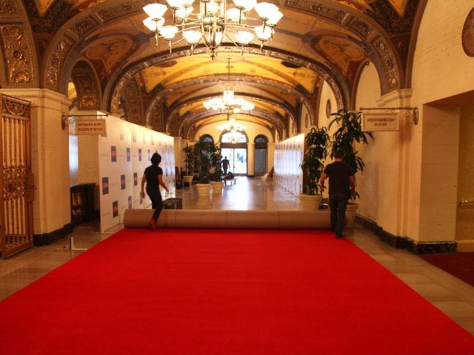 Unrolling big red carpet