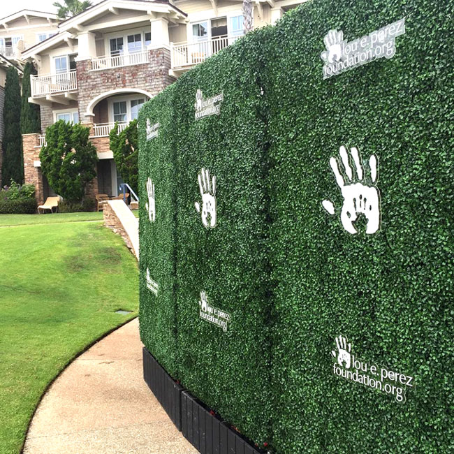 green privacy hedge with custom branding