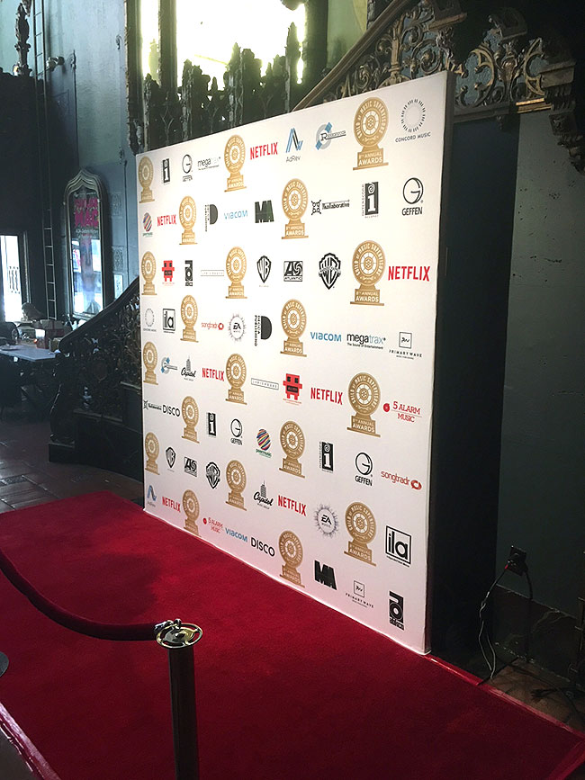 Photo backdrop, red carpet and velvet rope installation in Hotel lobby