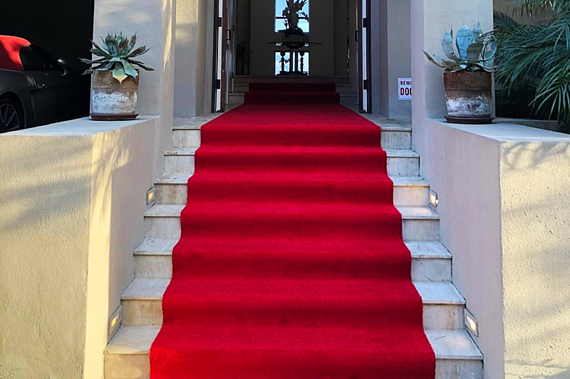 Red carpet installation on stairs