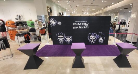 Hello Kitty backdrop, purple carpet and cocktail tables install by Red Carpet Systems