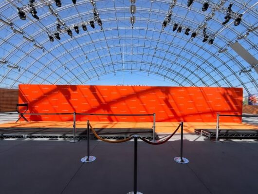 Orange Step and Repeat Carpet Arrival