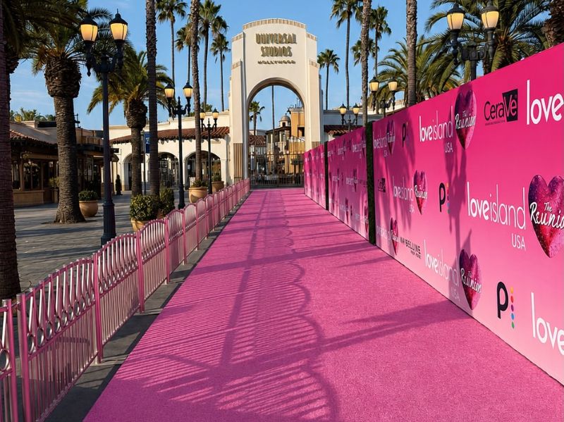 Love Island USA Season 8 Reunion pink carpet and backdrop installation at Universal Studios Hollywood by Red Carpet Systems.